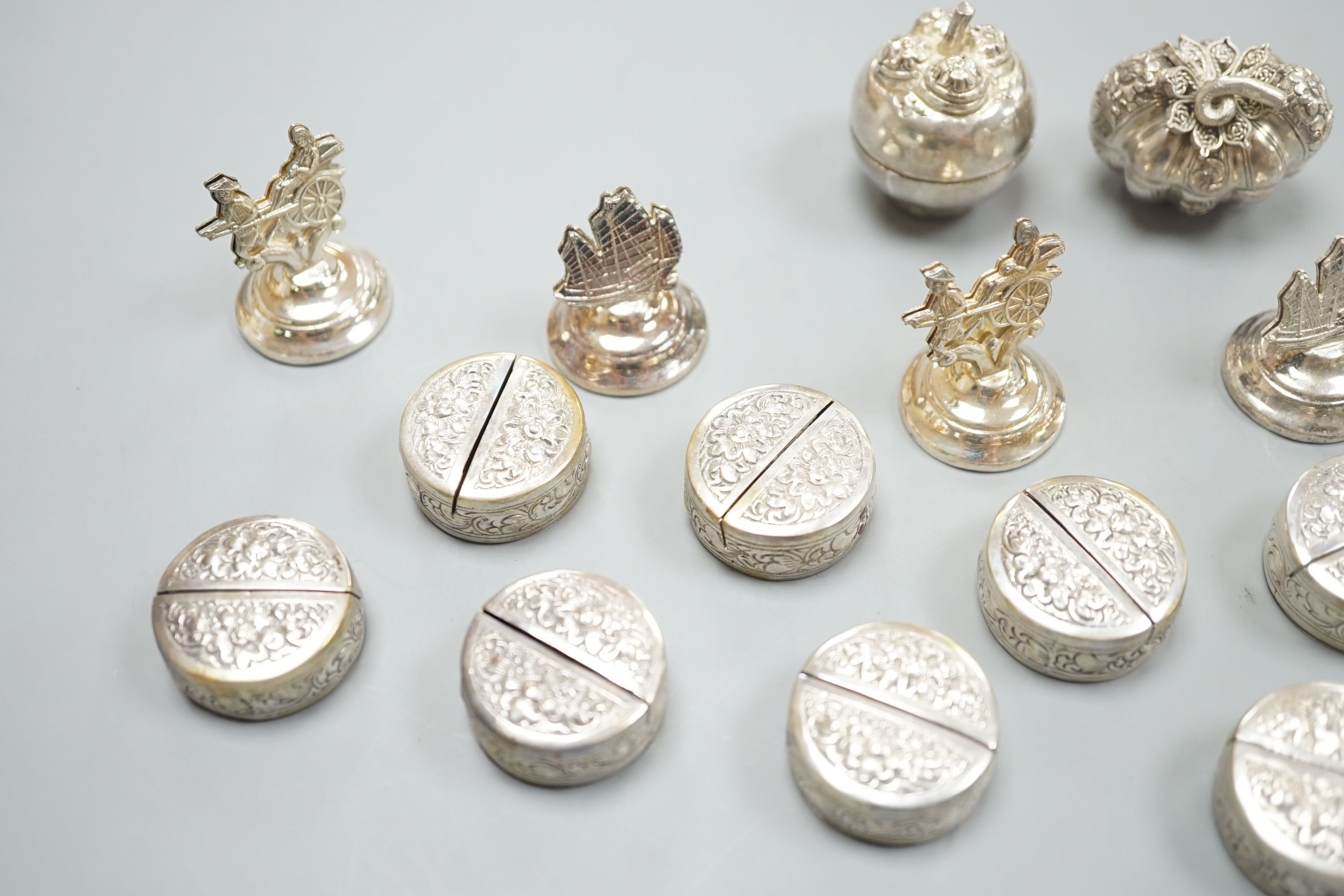 Six Hong Kong sterling menu holders and twelve Cambodian 900 standard white metal place setting holders and two Balinese boxes.